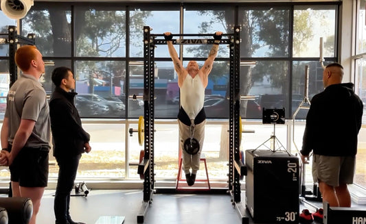 Most pull ups in 60 seconds, wearing a 5kg weight plate