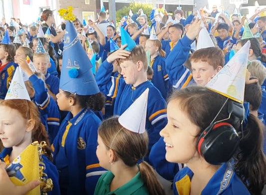 The most people wearing conical party hats whilst celebrating