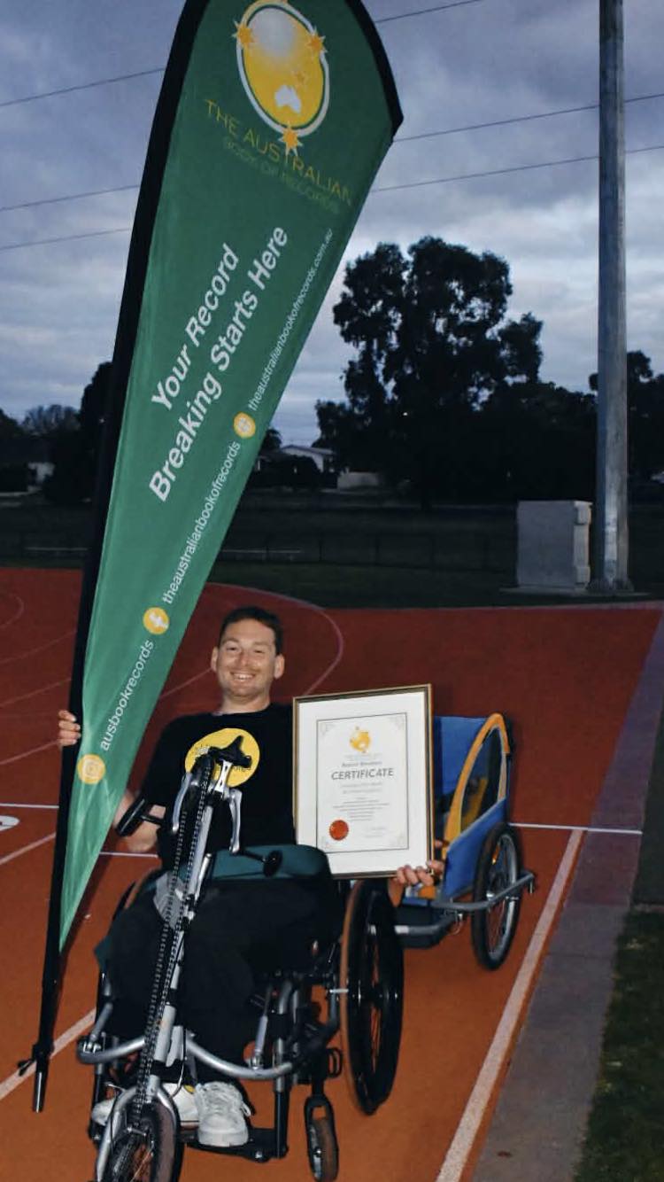 Wheelchair marathon whilst towing a 24kg kettlebell