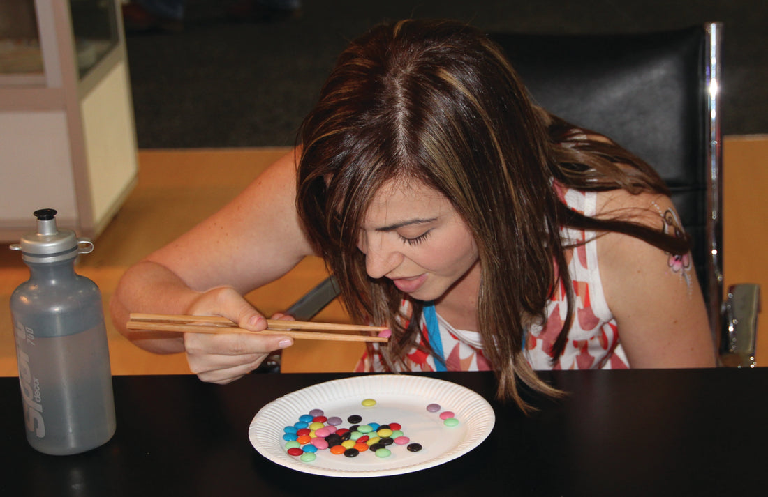 Fastest time to eat 50 smarties with chopsticks Catherine Fenech